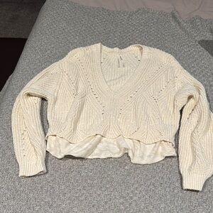 Cozy Cream V-Neck Sweater with Ruffle Hem